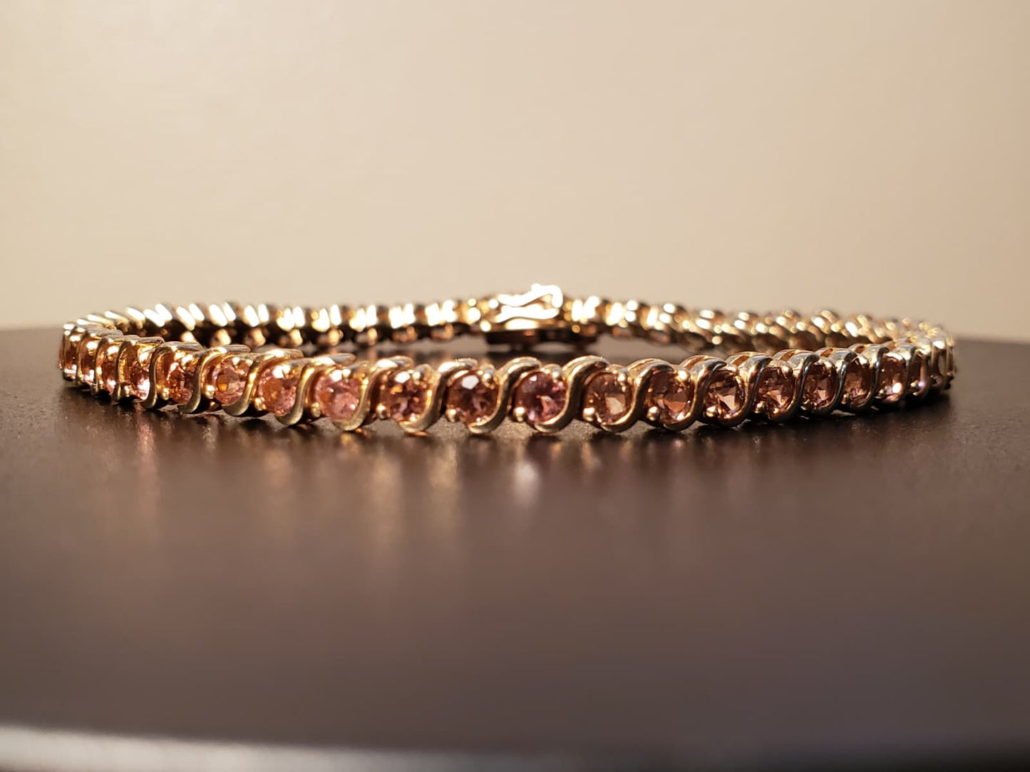 10 K STS  Pink Topaz Tennis Bracelet. 7.5"